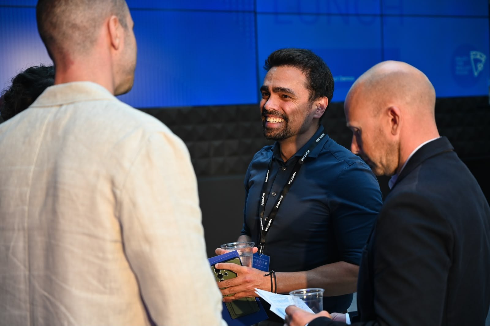 Speakers sharing a laugh before the keynote