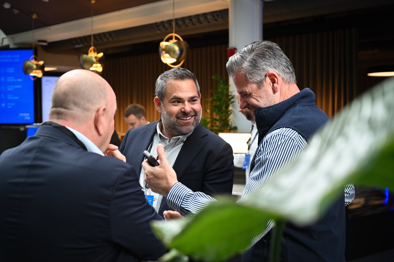 Conversation over coffee at a networking break